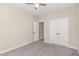 Bedroom featuring carpet, a ceiling fan, and an adjacent doorway for easy access to other areas of the house at 2440 Us 70 A, Selma, NC 27576