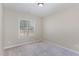 Neutral bedroom featuring plush carpet, a window for natural light, and fresh paint throughout the space at 2440 Us 70 A, Selma, NC 27576