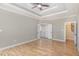 Bedroom showcasing hardwood floors, complemented by an ensuite bathroom and convenient access to the staircase at 2440 Us 70 A, Selma, NC 27576