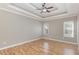 Spacious bedroom featuring hardwood floors, neutral paint, and a modern ceiling fan for added comfort at 2440 Us 70 A, Selma, NC 27576