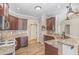 Gourmet kitchen features granite countertops, stainless steel appliances, and dark wood cabinets at 2440 Us 70 A, Selma, NC 27576