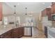 Well-equipped kitchen features a breakfast bar, stainless steel appliances and a stylish backsplash at 2440 Us 70 A, Selma, NC 27576