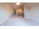 Upstairs bonus room has carpeted floor, neutral colors, and access to other parts of the home at 2620 Club Level Dr, Apex, NC 27523