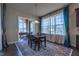 Inviting dining room with large windows and elegant curtains at 2620 Club Level Dr, Apex, NC 27523