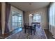 Bright dining room with large sliding glass doors and refined decor at 2620 Club Level Dr, Apex, NC 27523