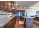 Well-equipped kitchen with granite countertops, stainless appliances, and ample cabinet space at 2620 Club Level Dr, Apex, NC 27523