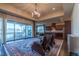 Spacious living room featuring hardwood floors, a rug, view to the back porch, and access to the kitchen at 2620 Club Level Dr, Apex, NC 27523