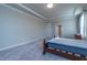 Bright main bedroom featuring crown molding and large windows; a peaceful retreat at 2620 Club Level Dr, Apex, NC 27523