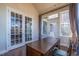 Bright office featuring glass doors, a desk, and natural light from multiple windows at 2620 Club Level Dr, Apex, NC 27523