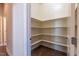 Walk-in pantry with built-in shelving for organized storage at 2620 Club Level Dr, Apex, NC 27523