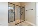 Beautiful tile shower with seamless glass door and dual shower heads at 2620 Club Level Dr, Apex, NC 27523