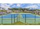Community tennis courts with blue and green surfaces, enclosed by a black chain link fence at 2620 Club Level Dr, Apex, NC 27523