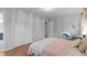 This bedroom features hardwood flooring, a closet, and an overall light color scheme at 2808 Newquay St, Durham, NC 27705