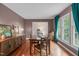 Dining room with wood floors, natural light, and modern decor, perfect for entertaining at 2808 Newquay St, Durham, NC 27705