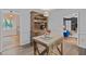Open kitchen with an island and adjacent rooms at 2808 Newquay St, Durham, NC 27705