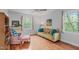 Bright living room with plenty of natural light, wood floors, and comfortable furniture at 2808 Newquay St, Durham, NC 27705