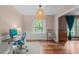 Inviting office with wood floors, great natural light, and a comfortable seating area at 2808 Newquay St, Durham, NC 27705