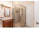 Bathroom features a glass shower, granite vanity, and attractive tile at 2868 Anfield Rd, Raleigh, NC 27606