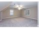 Large carpeted bedroom with fan and natural light at 2868 Anfield Rd, Raleigh, NC 27606
