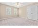 Bedroom including a ceiling fan, closet, and window for comfortable living at 2868 Anfield Rd, Raleigh, NC 27606