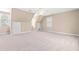 Spacious carpeted bedroom featuring natural light, ceiling fan and convenient built-in storage at 2868 Anfield Rd, Raleigh, NC 27606