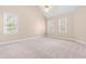 Bedroom with a ceiling fan and multiple windows letting in natural light at 2868 Anfield Rd, Raleigh, NC 27606
