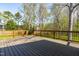 Large outdoor deck overlooking the backyard providing space for entertaining and relaxing at 2868 Anfield Rd, Raleigh, NC 27606
