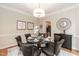 Elegant dining room with hardwood floors and decorative light fixture at 2868 Anfield Rd, Raleigh, NC 27606
