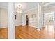 Open dining area with hardwood floors and staircase access at 2868 Anfield Rd, Raleigh, NC 27606