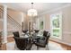 Bright dining area with hardwood floors and view of foyer staircase at 2868 Anfield Rd, Raleigh, NC 27606