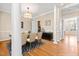 Staged dining room with hardwood floors and staircase access at 2868 Anfield Rd, Raleigh, NC 27606