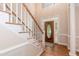 Inviting foyer with hardwood floors and decorative front door with sidelights at 2868 Anfield Rd, Raleigh, NC 27606