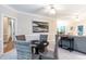 Cozy game room with four woven chairs, game table, and neutral color scheme, perfect for entertaining at 2868 Anfield Rd, Raleigh, NC 27606