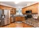 Well-appointed kitchen with granite countertops and stainless steel appliances at 2868 Anfield Rd, Raleigh, NC 27606