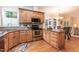 Well-lit kitchen featuring stainless steel appliances and ample cabinet space at 2868 Anfield Rd, Raleigh, NC 27606