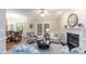 Cozy living room with fireplace and adjacent eat-in kitchen at 2868 Anfield Rd, Raleigh, NC 27606