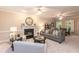 Inviting living room features a fireplace, neutral decor, and plush seating for comfortable living at 2868 Anfield Rd, Raleigh, NC 27606