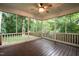 Screened-in porch with wood floor, fan, and view of the backyard at 2868 Anfield Rd, Raleigh, NC 27606
