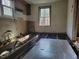 Kitchen renovation in progress, revealing the floor structure and awaiting custom finishes at 307 Watson St, Creedmoor, NC 27522