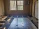 Interior shot showing exposed studs and floor joists during a home renovation project at 307 Watson St, Creedmoor, NC 27522