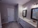 Stylish bathroom featuring double vanities, modern fixtures, and tile flooring at 32 Tanseyleaf Dr, Smithfield, NC 27577
