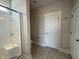 Clean bathroom featuring a tiled shower, a separate toilet, and neutral walls at 32 Tanseyleaf Dr, Smithfield, NC 27577