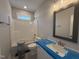 New bathroom with modern fixtures, including a shower-tub combo and a sleek vanity at 32 Tanseyleaf Dr, Smithfield, NC 27577