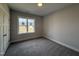 Bright, carpeted bedroom with a window that lets in plenty of natural light at 32 Tanseyleaf Dr, Smithfield, NC 27577