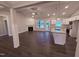 Bright living space with fireplace, wood floors, and lots of windows looking out on the front yard at 32 Tanseyleaf Dr, Smithfield, NC 27577