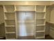 Large walk-in closet with custom shelves and plenty of storage space at 32 Tanseyleaf Dr, Smithfield, NC 27577