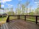 Spacious wooden deck perfect for outdoor entertaining and relaxation with a view of backyard and woods at 329 Chamberlain Dr, Clayton, NC 27527