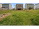 A large backyard featuring well-maintained lawns and beautiful neighborhood homes in the background at 329 Chamberlain Dr, Clayton, NC 27527
