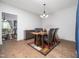 Bright dining room features modern table with seating for four and decorative chandelier at 329 Chamberlain Dr, Clayton, NC 27527