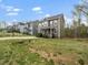 View of the home's exterior showcasing curb appeal with manicured lawn and neighborhood street at 329 Chamberlain Dr, Clayton, NC 27527